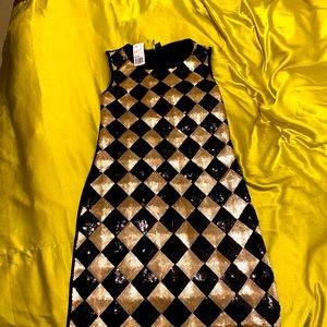 Black gold sequined mini dress .